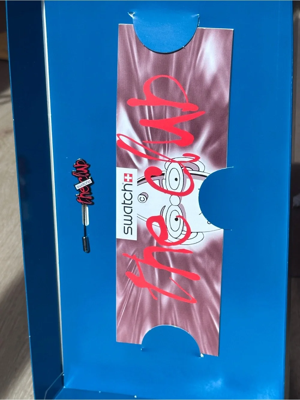 Swatch Club watch with display case and brooch